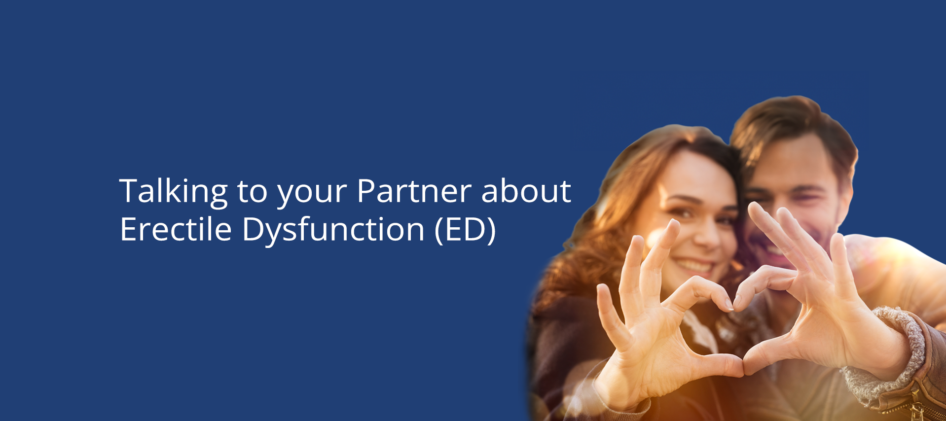 Smiling couple making a heart shape with their hands, outdoors with sunlight